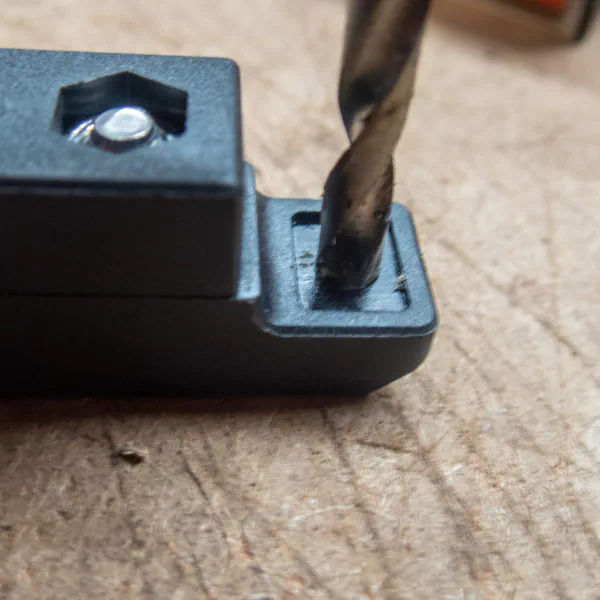 Drilling out the hole to widen from 4mm to 5mm for an M5 bolt.