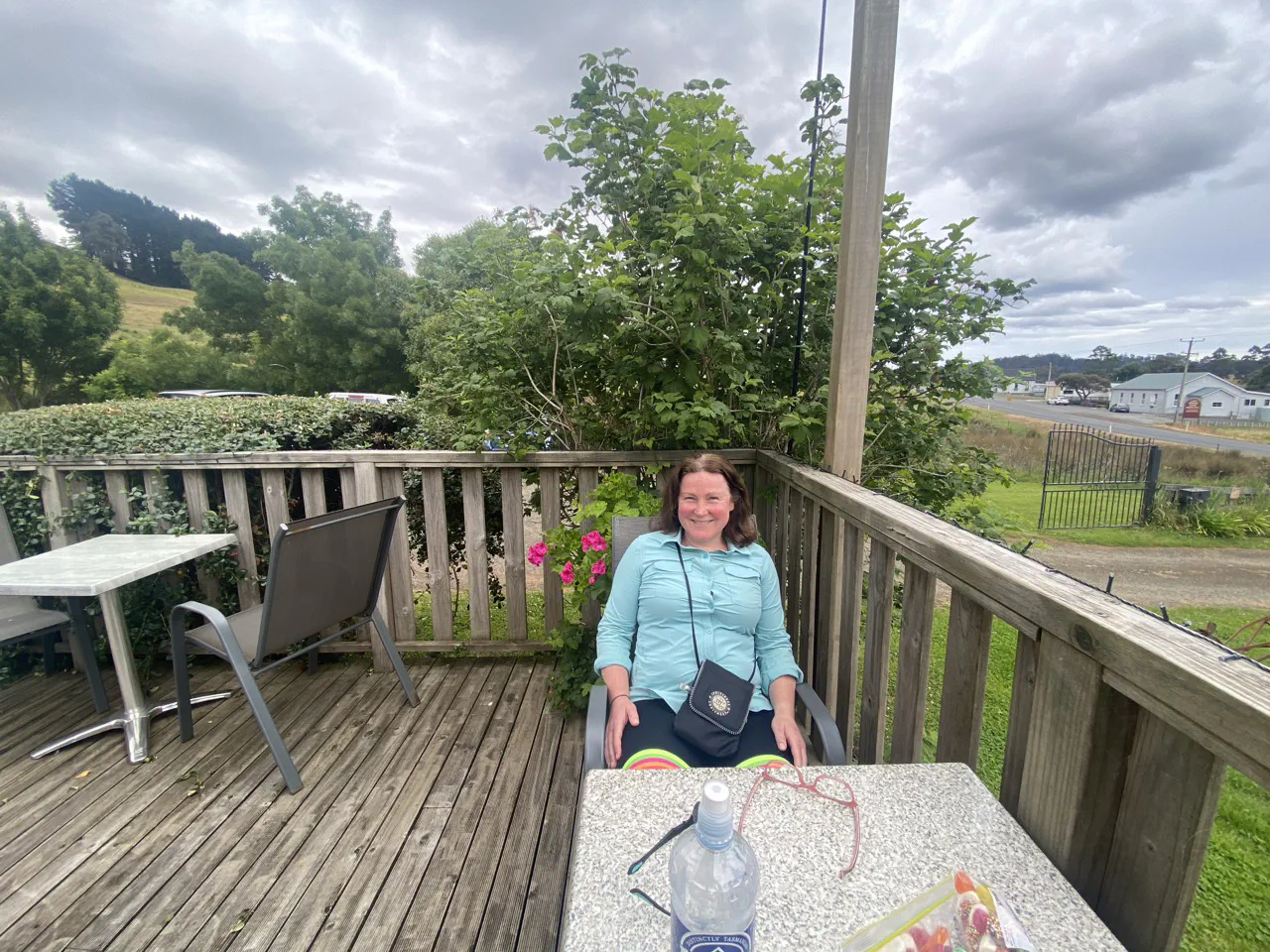 Danielle resting on the porch outside the Blue Barn Café