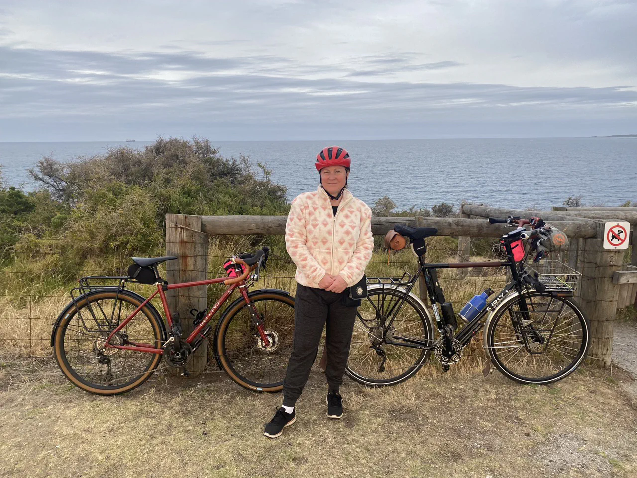 Danielle and the bikes with Bass Strait in the background